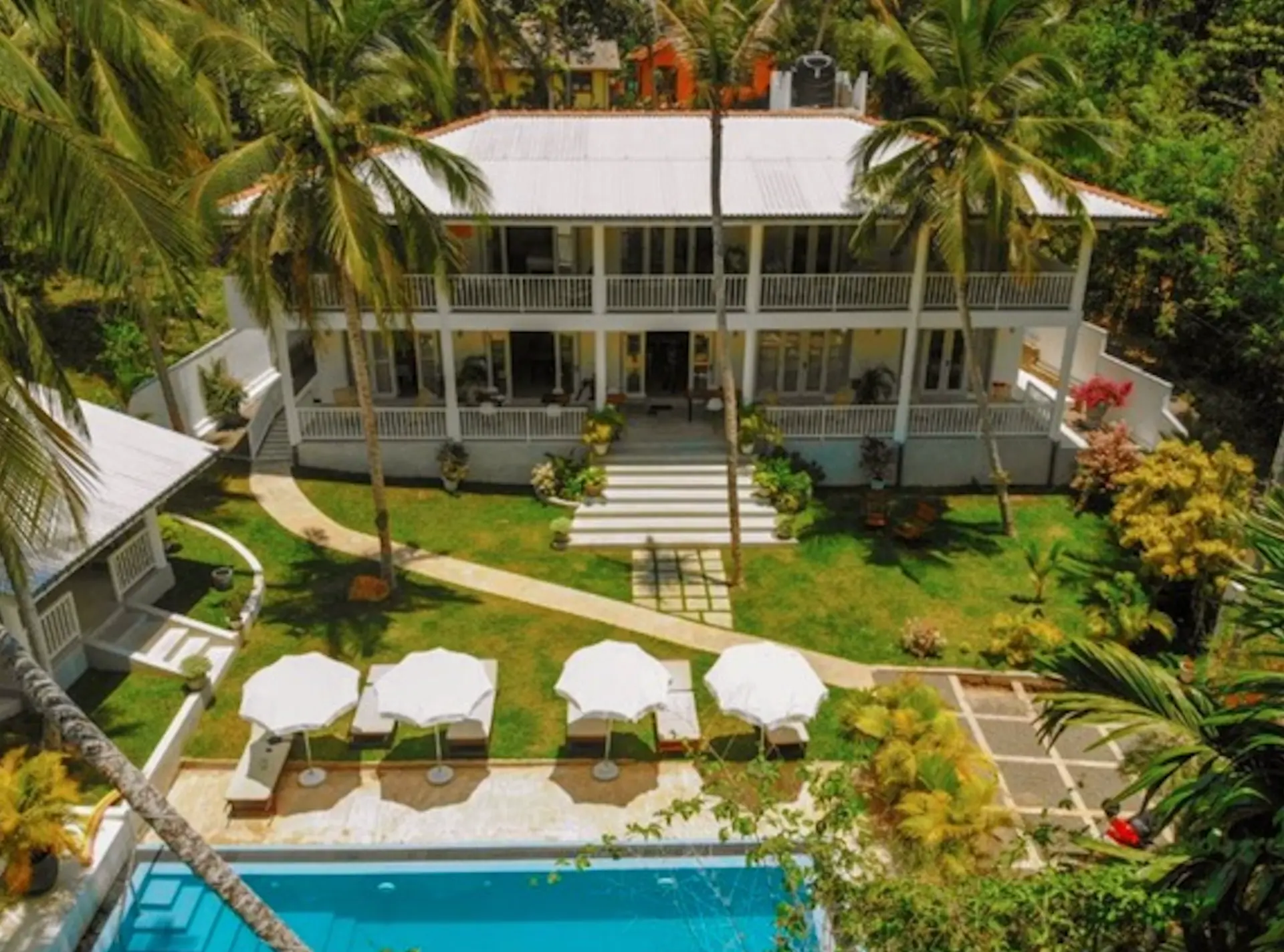 Aerial view of the jungle villa, tropical garden and swimming pool